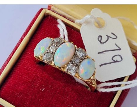 A STUNNING THREE STONE OPAL AND DIAMOND (6) RING 18CT GOLD SIZE S - 7 GMS 