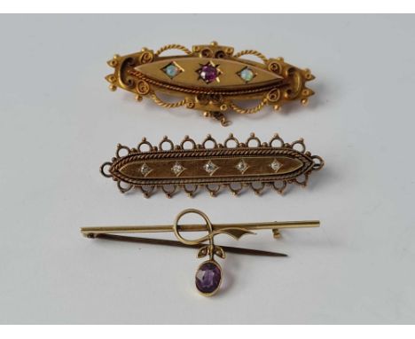  Three assorted gold brooches (amethyst diamond ruby and opal) - 12.5 gms 