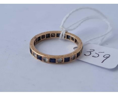 A sapphire and white stone eternity ring set in gold, size R - 3.4g