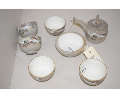 A Japanese ceramic part tea set, comprising: five tea bowls decorated birds and foliage on matt-grey ground, with matching mi