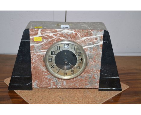 An Art Deco mantel clock with decorative alabaster panel.