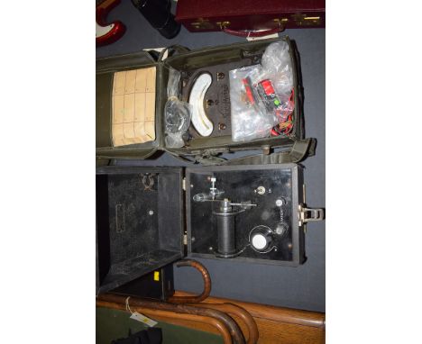A vintage universal Avometer in protective vinyl case; together with another electrical instrument by Sloggett & Slade, in bl
