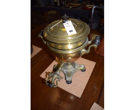 A Victorian brass samovar with turned wooden finial, handle and seat.