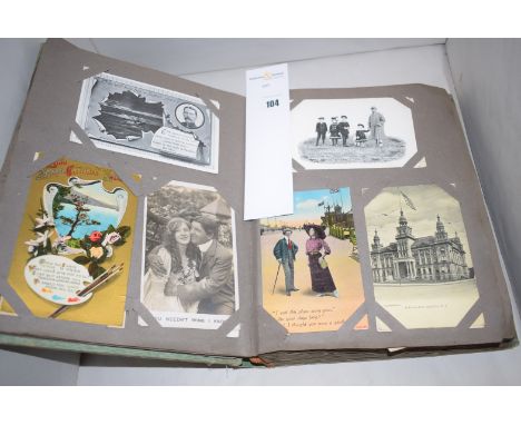 An album of vintage photographs and postcards.