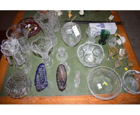 A quantity of crystal glass, including: vases; bowl; table lustre; scent spray; pair of candlesticks; etc.