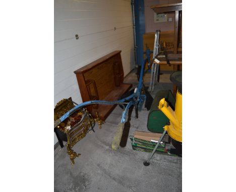 A Howard SB1 horse-drawn riding plough with adjustable hitch, two land wheels and original spanner (mould boards worn).