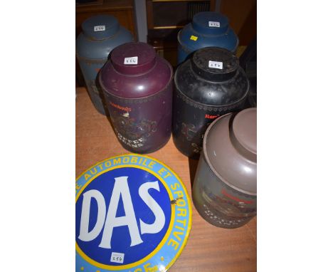 Five decorated coffee tins; and an enamel sign.