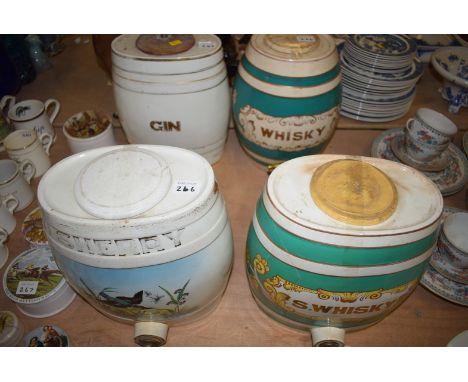 Four Victorian pottery spirit barrels 'Gin', 'Whisky', 'Sherry' and 'S. Whisky', with brass taps.