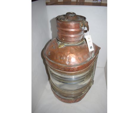 A ship's copper masthead navigation light, with clear dioptric lens (case only no lamp).