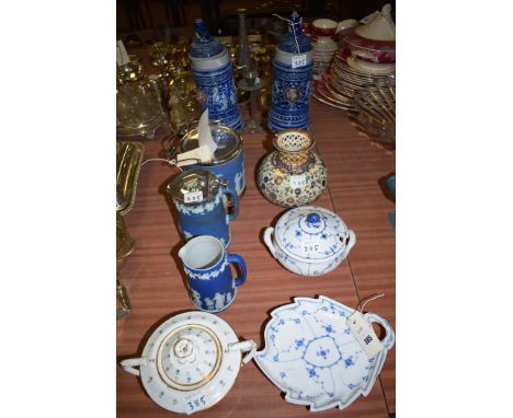 A Wedgwood blue Jasper ware biscuit barrel with plated mounts; a tapering circular jug with plated cover; and another similar