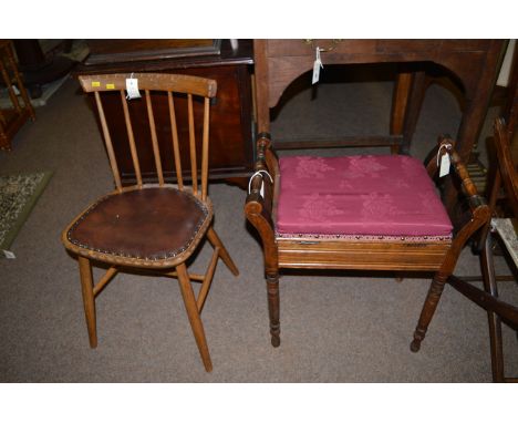 A stained wood piano stool with hinged box seat; together with a spindle back dining chair.  (2)