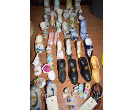 A collection of decorative ceramic shoes.