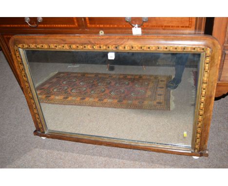 A late 19th Century inlaid walnut framed wall mirror with Tunbridge ware surround.