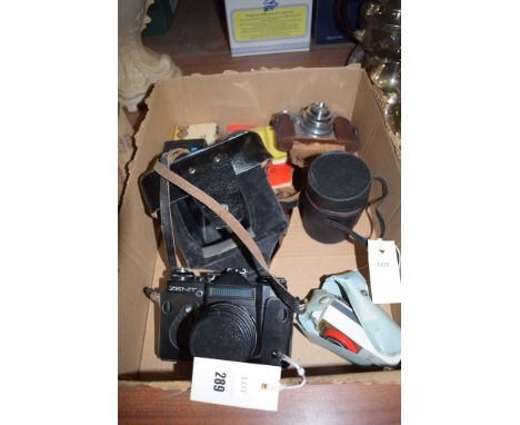 A box containing a Zenith camera; a Relex camera; together with accessories.