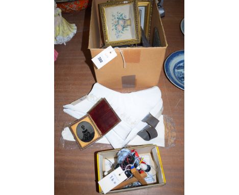 A box containing miniature picture frames; a pair of white coloured leather spats; a pair of chamois leather gloves; and a Pe
