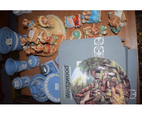 Four boxed Wedgwood collectors' plates; a quantity of blue Jasper ware ornaments including: vases, table lighter; and a colle