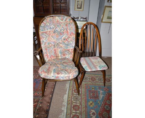 A set of four Ercol spindle back chairs; together with an Ercol spindle back easy armchair.