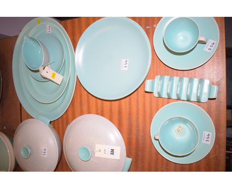 Poole pottery part dinner service, comprising: a pair of tureens, two graduating meat plates, four dinner plates, two teacup 