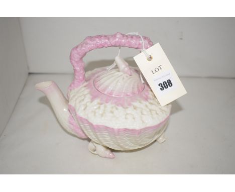 A Belleek shell-shaped teapot with clam shell lid and shell finial, highlighted in pink with black back stamp.