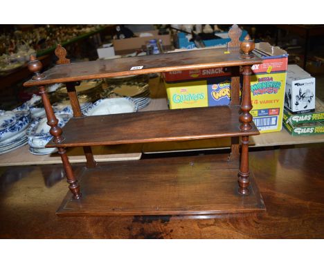 An early 20th Century mahogany open shelf unit.