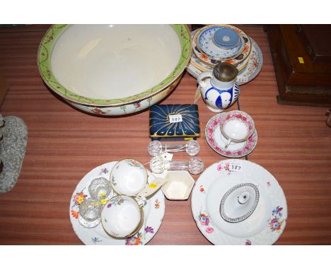 A Continental ceramic jug with blue and white raised decoration and lion mask, raised panel and a hinged metal cover; three a