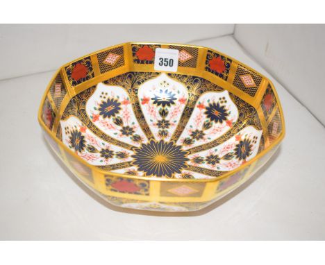 A Royal Crown Derby octagonal ceramic bowl, decorated in Imari colours, pattern no. 1128, with roman letters XLI below.