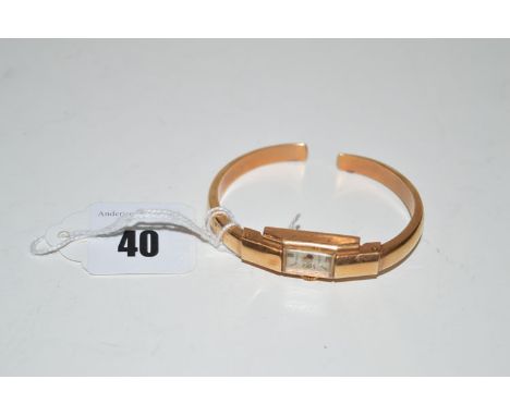 An 18ct. yellow gold cased bangle watch by Sigma, 11.9grms gross.