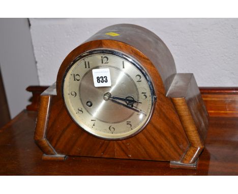 An Art Deco walnut mantel clock.