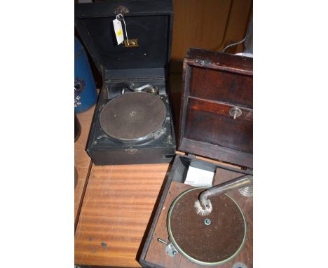 Two vintage wind-up table gramophones.