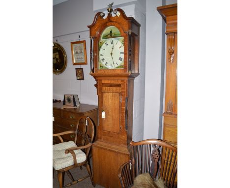 A 19th Century longcase clock in oak and mahogany case, with arched enamel dial and thirty hour movement.
