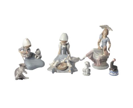 Collection of Lladro Collectors Society figures and other models, including girl with a parasol, 22cm, snowman, etc.Qty: 27Co