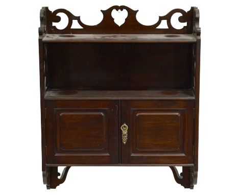 Edwardian stained walnut wall cabinet, fretted outlines, with an open shelf above two panelled doors, width 62cm, height 78cm