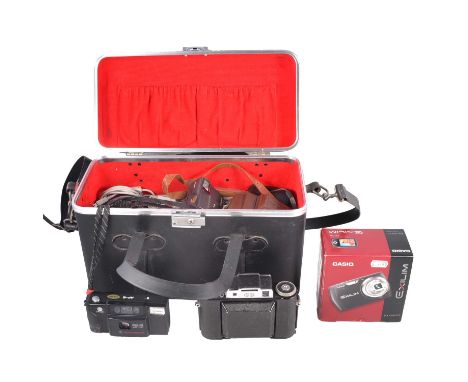 A collection of compact cameras and 35mm cameras, with a storage case.