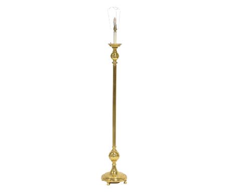 Brass standard lamp, fluted column, circular base, height to fitment 142cm.