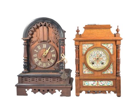 Continental oak cased cockoo mantel clock, the movement with two sets of bellows and striking on a gong, 48cm, an oak cased m