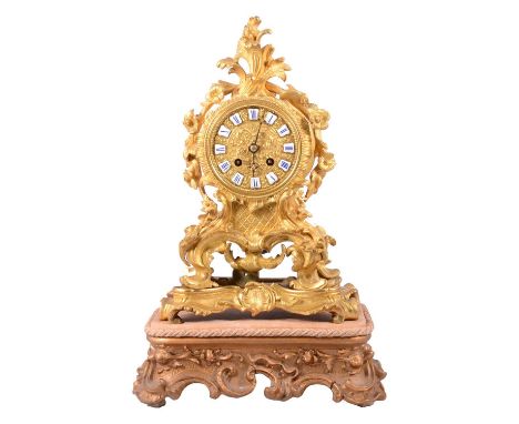 Charles X ormolu mantel clock, Raingo Frères, Paris, 1830’s, the case with cast rococo scrolls, dial has enamelled numerals s
