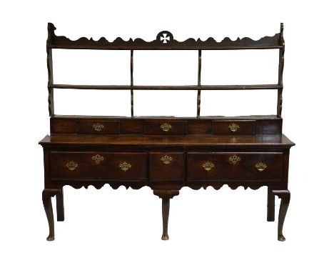 Joined oak dresser base, basically 18th century, matched low two shelf back, raised plate platform with three drawers, three 