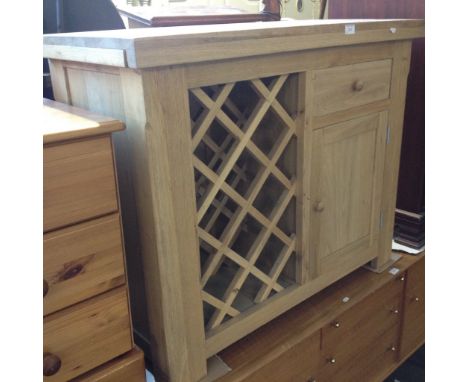 LIGHT OAK CABINET INCORPORATING WINE RACK. W100CM