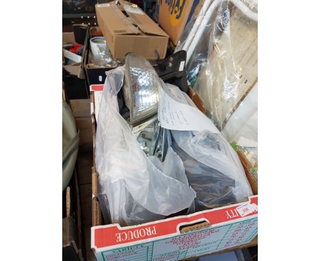 BOX OF NISSAN ALMERA CAR PARTS - HEAD LIGHT UNITS ETC.