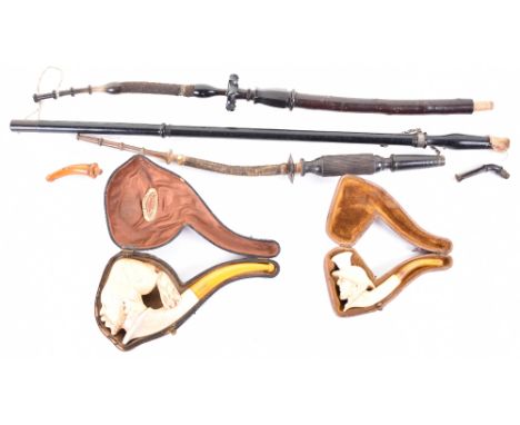 Finely carved meerschaum pipe bowl in the form of a Turk’s head, with stem , in its leather-covered case with label Au Bospho