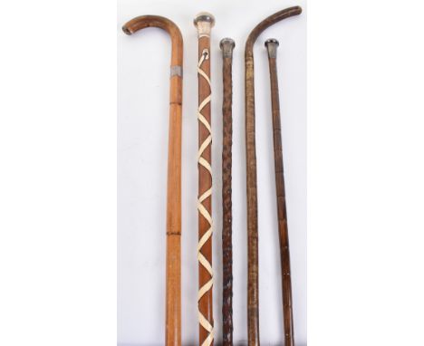 3x assorted walking sticks each with a silver top; the first hallmarked for London 1916 maker EN, male Malacca shaft wound wi