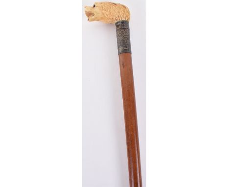 ^ Presentation walking stick 35.75”, ivory handle carved as a dog’s head, inlaid glass eyes, Malacca shaft, silver ferule H.M