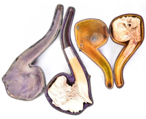 Finely carved meerschaum pipe bowl in the form of a lady’s head with stem, in its leather-covered case; and another carved as
