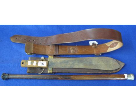 British military leather Sam Browne type belt with brass fittings, together with a plain swagger stick and a Perang knife in 