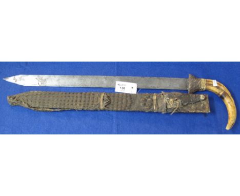 Middle Eastern ceremonial sword, the steel blade decorated with Islamic text and having horn handle within a crocodile skin s