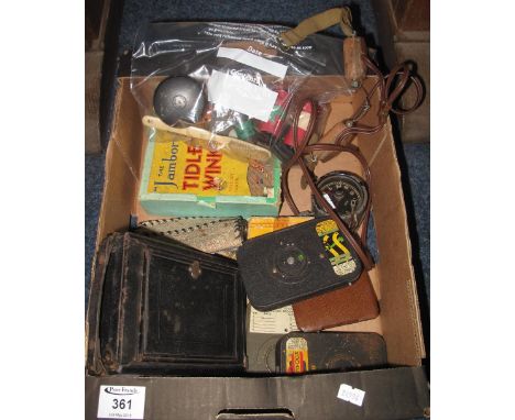 Box of assorted miscellaneous items to include: Tidleywinks game; vintage camera; vintage roll film; aircraft or car 8 day vi