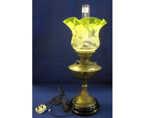Early 20th Century brass oil lamp now converted to electricity on a fluted pedestal with ceramic base, floral shade and clear