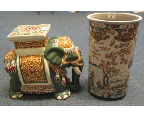 Enamelled ceramic garden seat in the form of an elephant with howdah, together with a Chinese design oval section, Imari colo