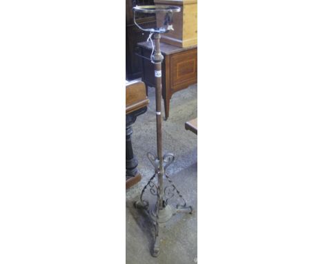 Wrought iron and brass scroll decorated tripod oil lamp base.(B.P. 24% incl. VAT)