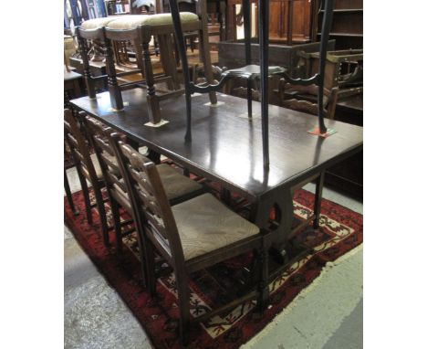 Mid 20th Century oak refectory type rectangular dining table together with a set of eight ladder back dining chairs with upho